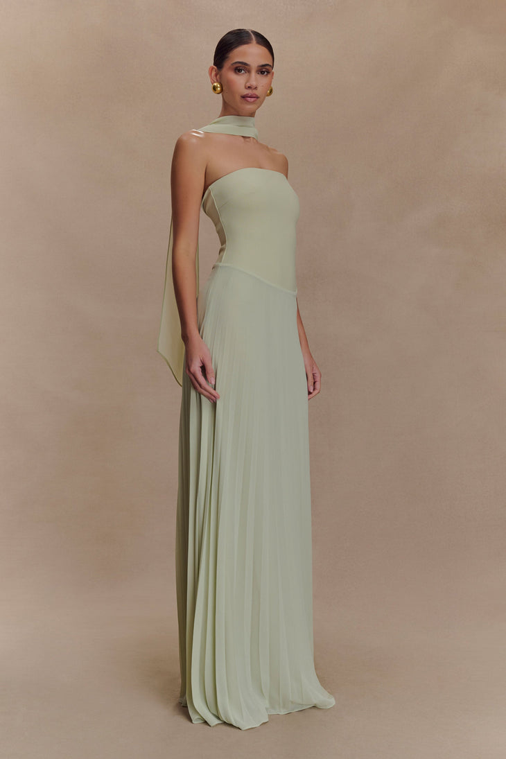 Woman wearing pale sage strapless maxi dress with pleated skirt and matching neck scarf — Meshki | Endless UAE