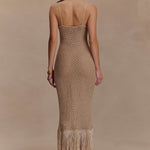 Woman wearing beige metallic knit midi dress with keyhole neckline and fringe hem — Meshki | Endless UAE