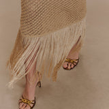 Woman wearing beige metallic knit midi dress with keyhole neckline and fringe hem — Meshki | Endless UAE
