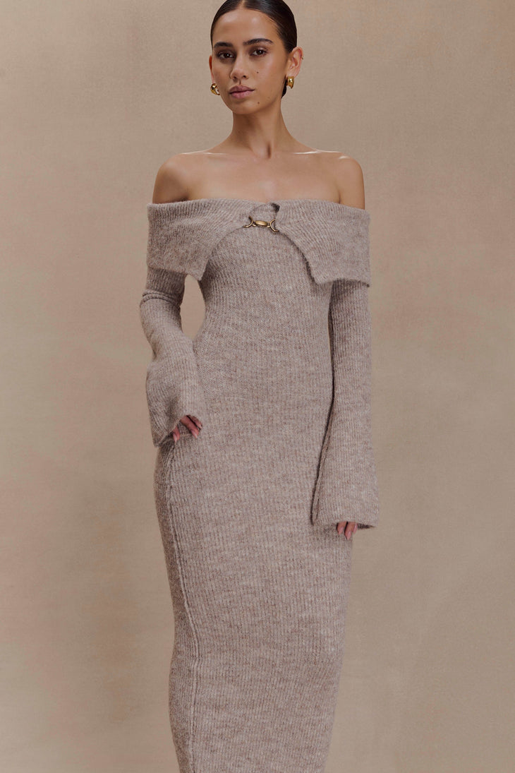 Woman wearing taupe off-shoulder knit midi dress with gold chain detail and long sleeves against neutral background — Meshki | Endless UAE