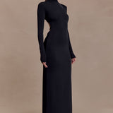 Black slinky maxi dress with high neck, long sleeves, and side cutout detail on model against neutral background — Meshki | Endless UAE