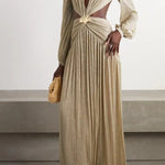 Gold pleated cutout maxi dress with twisted knot detail and long sleeves on model with woven clutch — Patbo | Endless UAE