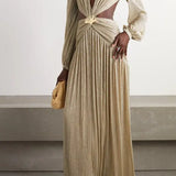Gold pleated cutout maxi dress with twisted knot detail and long sleeves on model with woven clutch — Patbo | Endless UAE
