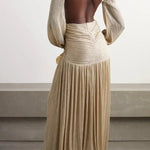 Gold pleated cutout maxi dress with twisted knot detail and long sleeves on model with woven clutch — Patbo | Endless UAE