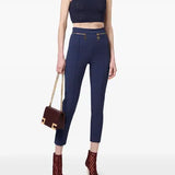 Navy sleeveless turtleneck crop top styled with high-waisted trousers and burgundy accessories — Elisabetta Franchi | Endless UAE
