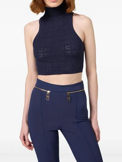 Navy jacquard sleeveless turtleneck crop top paired with high-waisted trousers — Elisabetta Franchi | Endless UAE