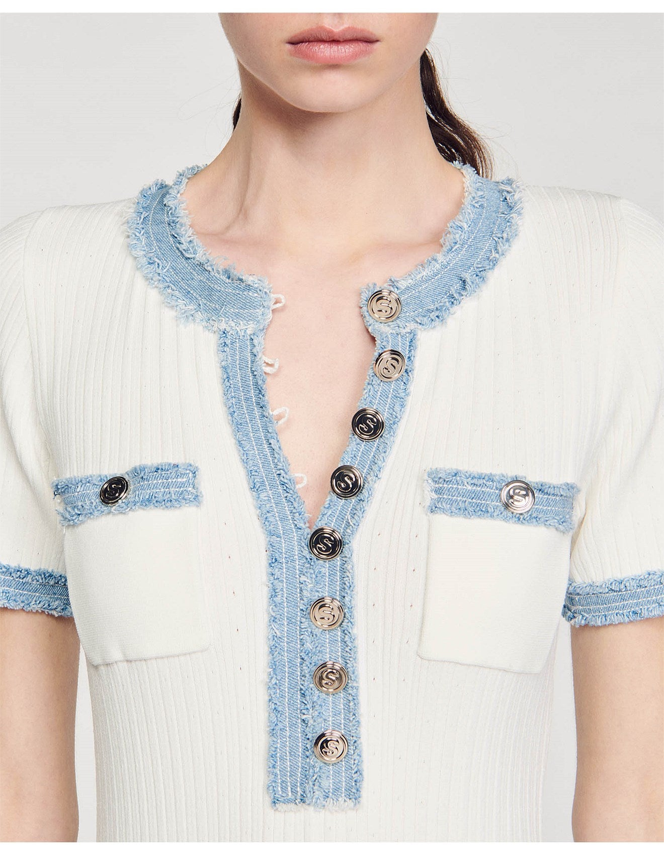 Cream ribbed knit dress with contrast blue denim-style trim and gold button detailing at front and chest pockets — Sandro | Endless UAE