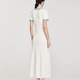 Rear view of woman wearing white ribbed knit maxi dress with denim trim detail and short sleeves — Sandro | Endless UAE