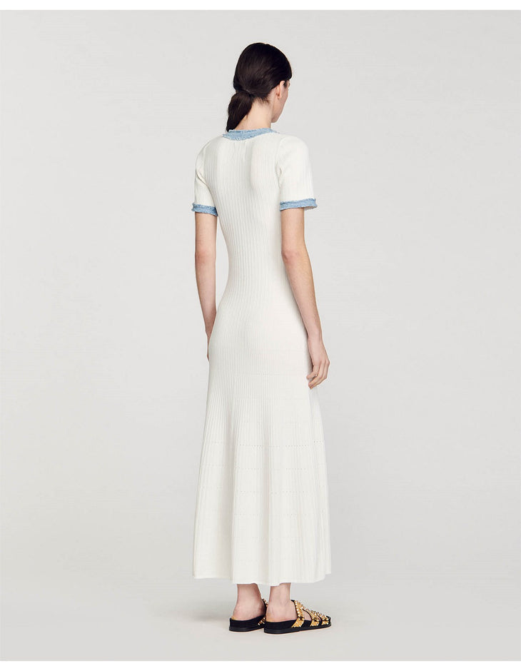 Rear view of woman wearing white ribbed knit maxi dress with denim trim detail and short sleeves — Sandro | Endless UAE
