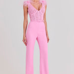 Woman wearing pink Anabelle jumpsuit with sequined bodice and feather shoulders — Nadine Merabi | Endless UAE