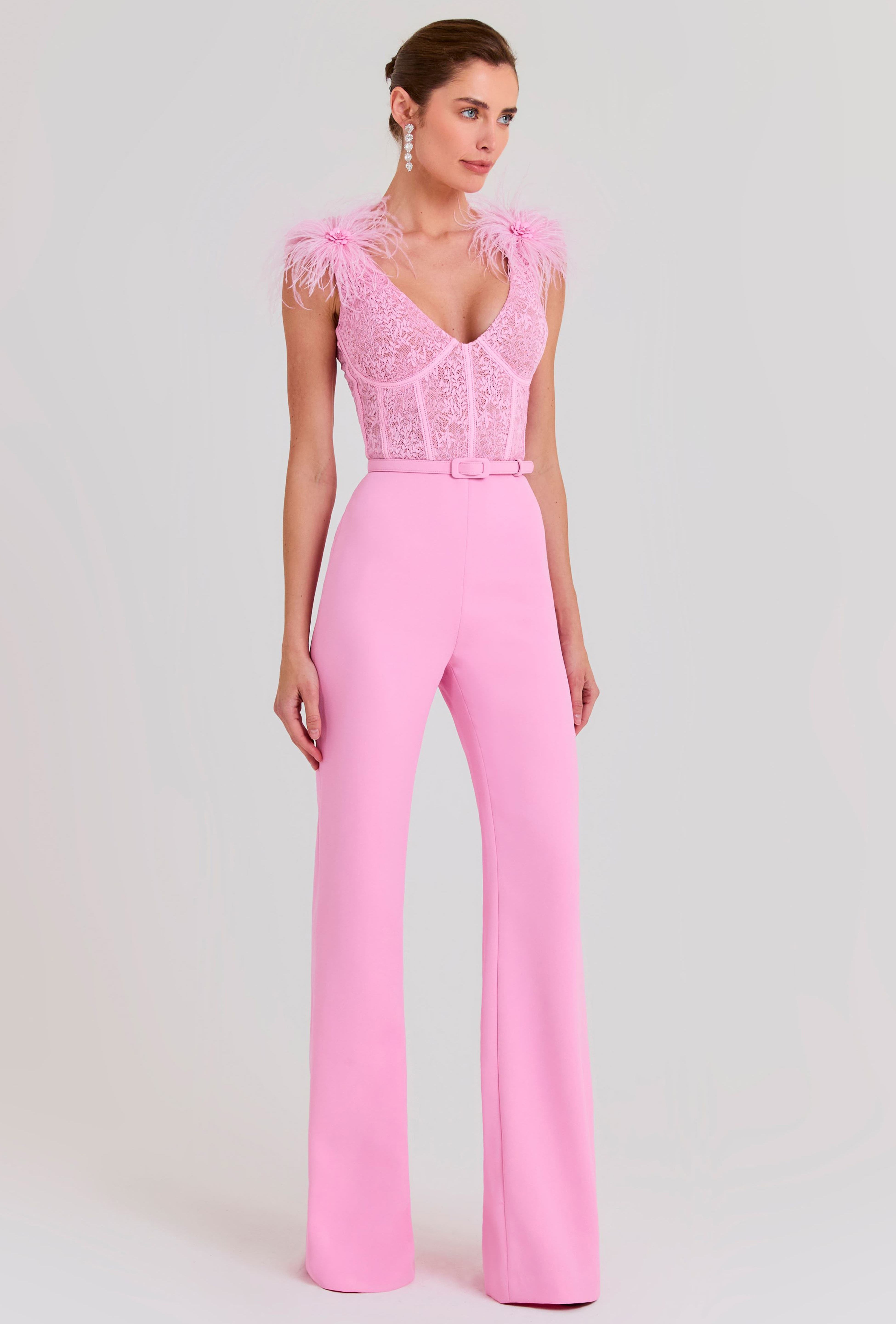Woman wearing pink Anabelle jumpsuit with sequined bodice and feather shoulders — Nadine Merabi | Endless UAE