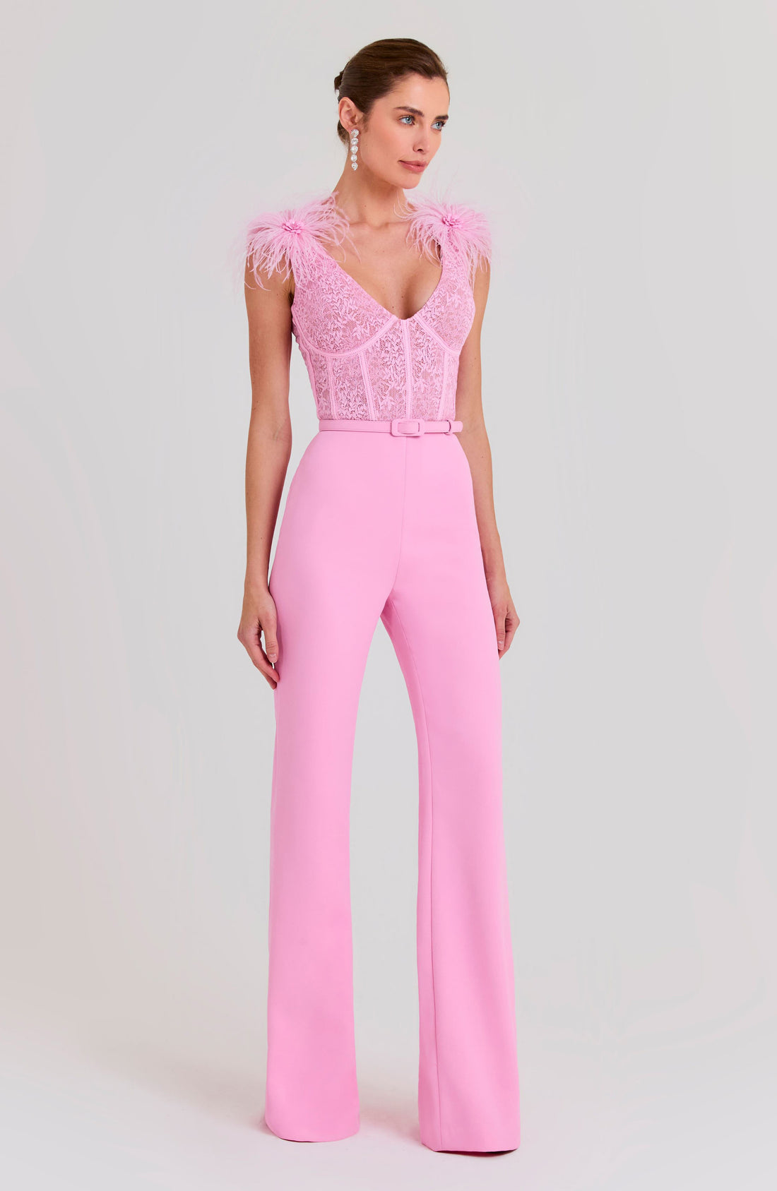 Woman wearing pink Anabelle jumpsuit with sequined bodice and feather shoulders — Nadine Merabi | Endless UAE