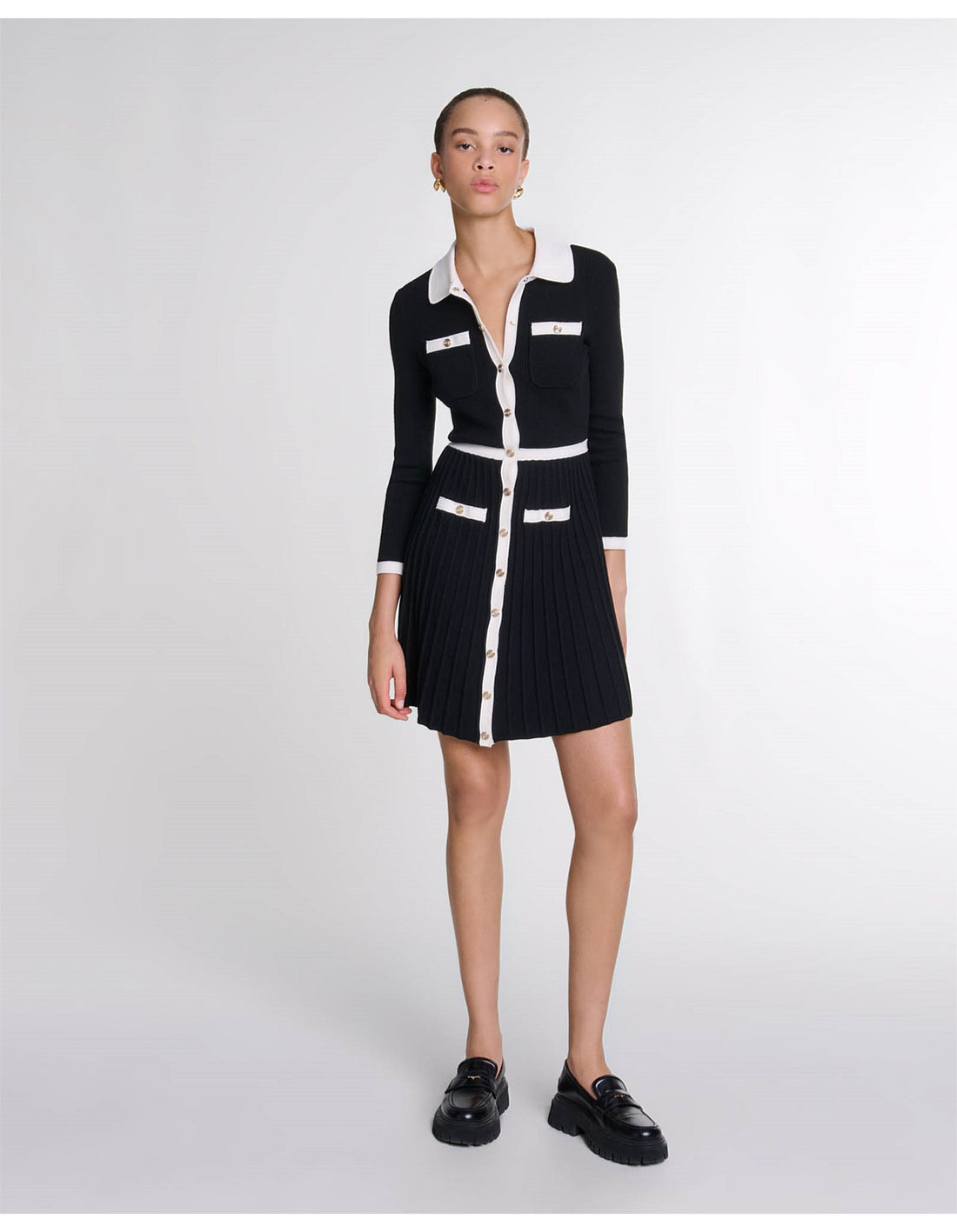 Black knit cardigan dress with white contrast trim, collar, pockets and pleated skirt, button-front closure — Maje | Endless UAE