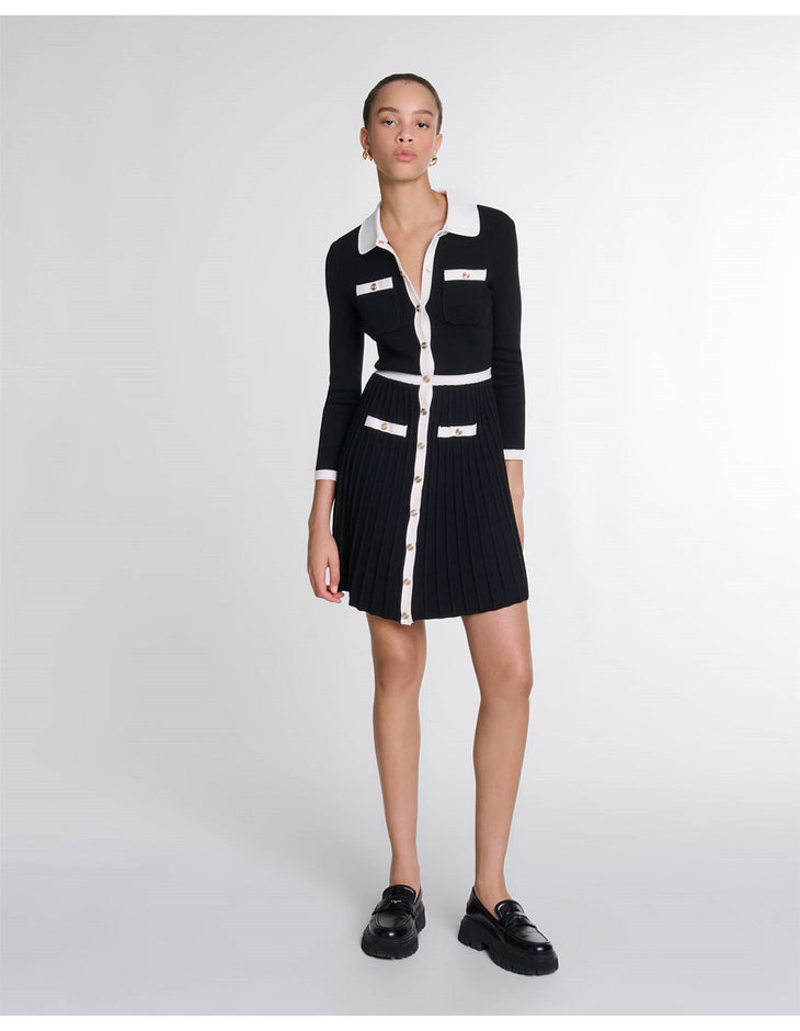 Black knit cardigan dress with white contrast trim, collar, pockets and pleated skirt, button-front closure — Maje | Endless UAE