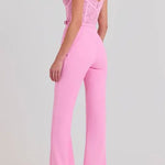 Woman wearing pink Anabelle jumpsuit with sequined bodice and feather shoulders — Nadine Merabi | Endless UAE