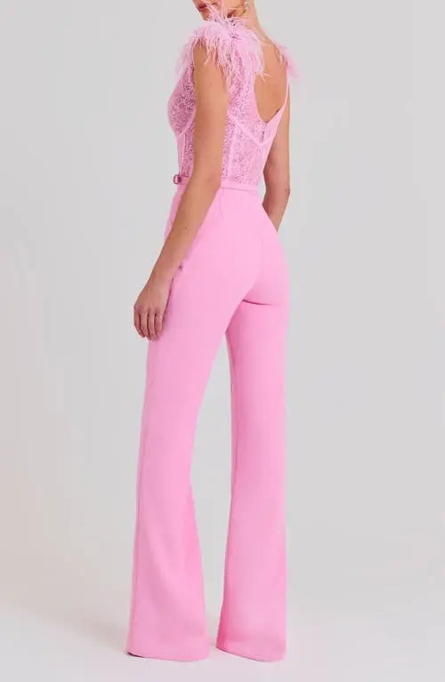 Woman wearing pink Anabelle jumpsuit with sequined bodice and feather shoulders — Nadine Merabi | Endless UAE