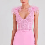 Woman wearing pink Anabelle jumpsuit with sequined bodice and feather shoulders — Nadine Merabi | Endless UAE