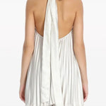 Pleated white halter dress and pants set with black embellished clutch — L'IDÉE | Endless UAE