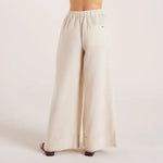 Woman wearing cream linen blend strapless blouse and wide-leg pants — Leo Lin | Endless UAE
