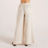 Woman wearing cream linen blend strapless blouse and wide-leg pants — Leo Lin | Endless UAE