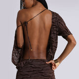 Brown zebra print backless mini dress with sheer sleeves and tie detail shown from behind — Jaded London | Endless UAE