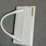 White leather shoulder bag with gold Jacquemus logo — Jacquemus | Endless UAE