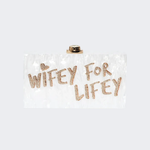 Wifey For Lifey clear clutch bag with gold glitter text and gold-tone hardware — Sophia Webster | Endless UAE
