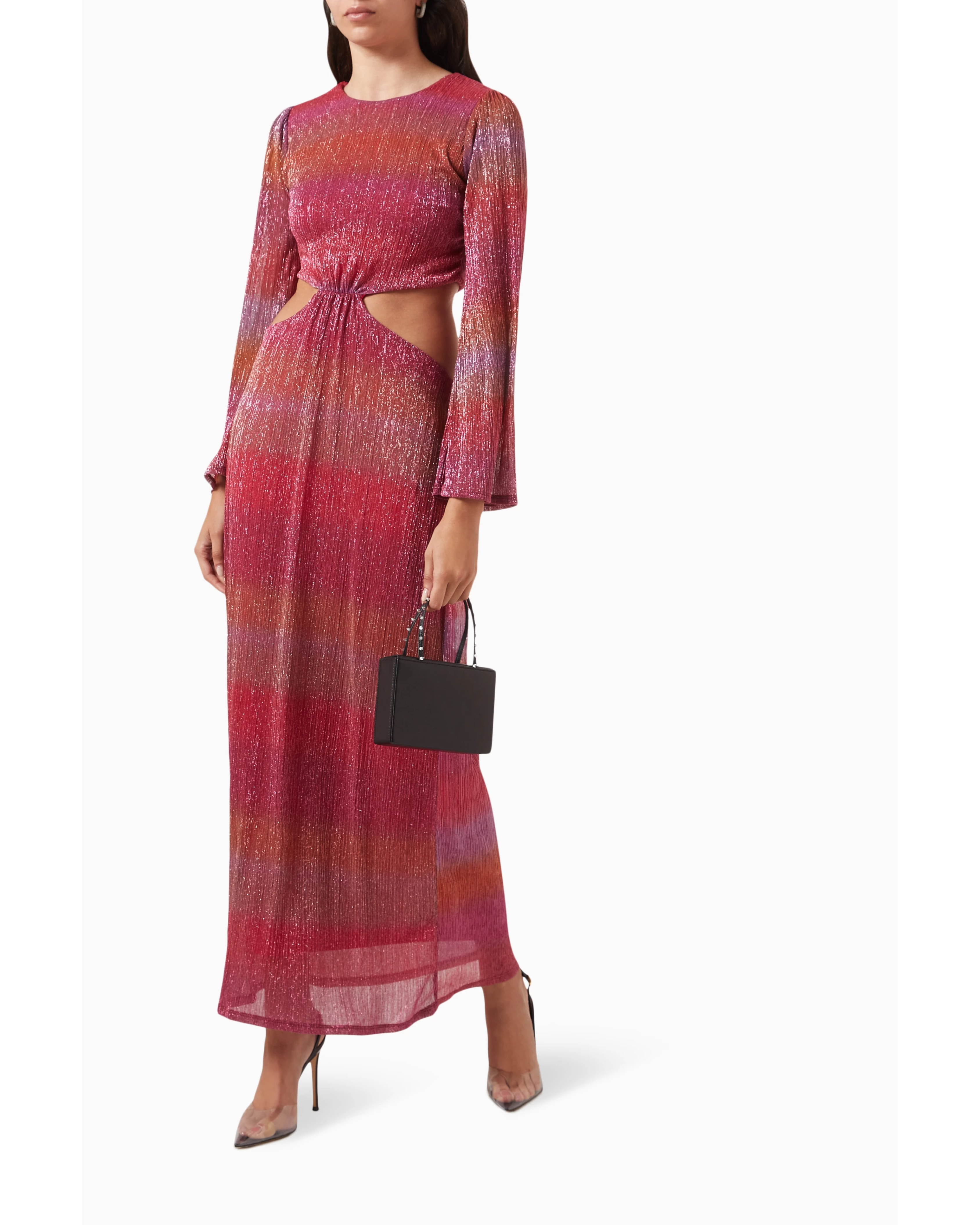 Shimmering pink ombré maxi dress with long sleeves and side cutouts, styled with heels and black clutch — Never Fully Dressed | Endless UAE