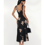 Woman wearing black Salima dress with white leaf embroidery and white shawl — Lady Pipa | Endless UAE