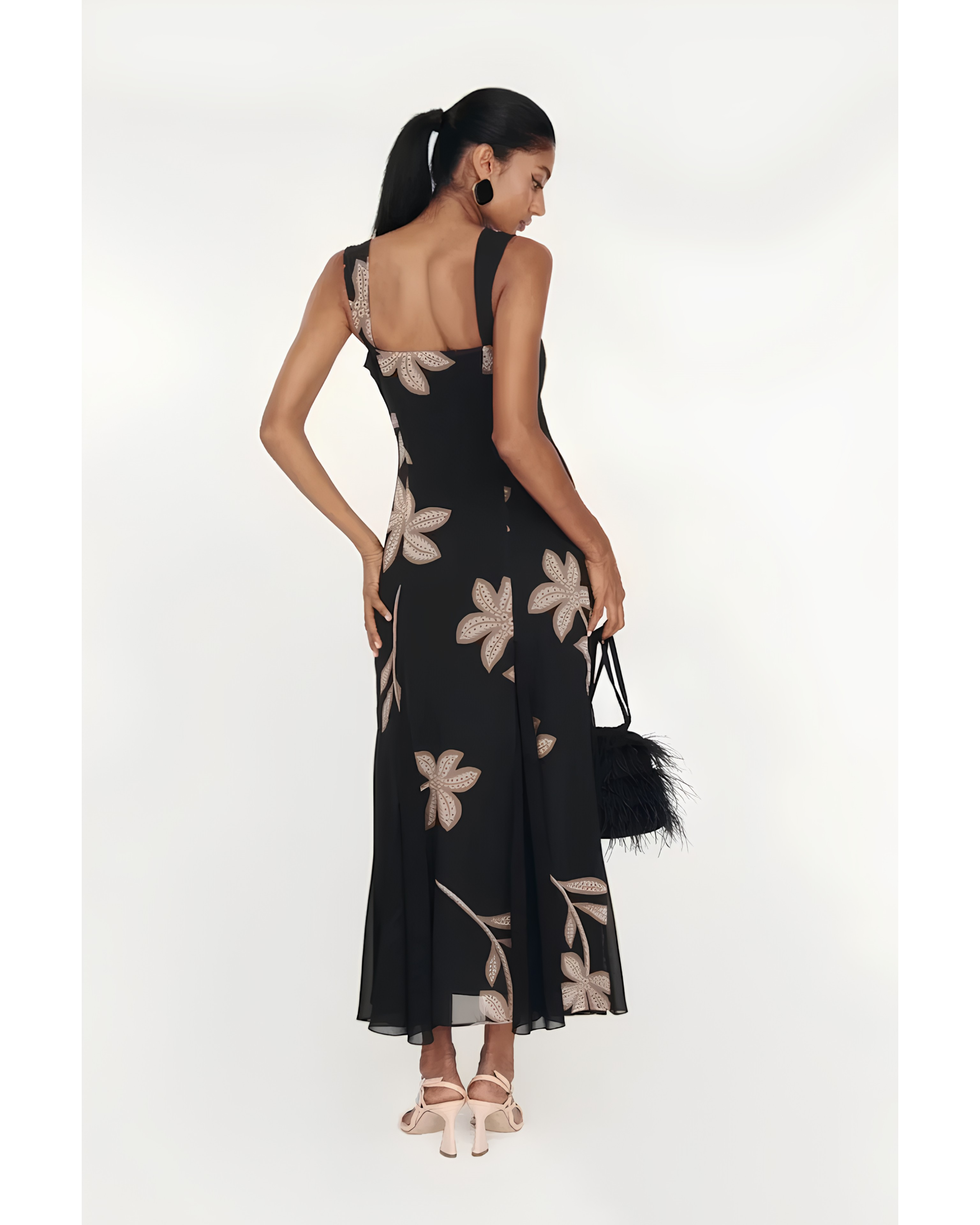 Woman wearing black Salima dress with white leaf embroidery and white shawl — Lady Pipa | Endless UAE