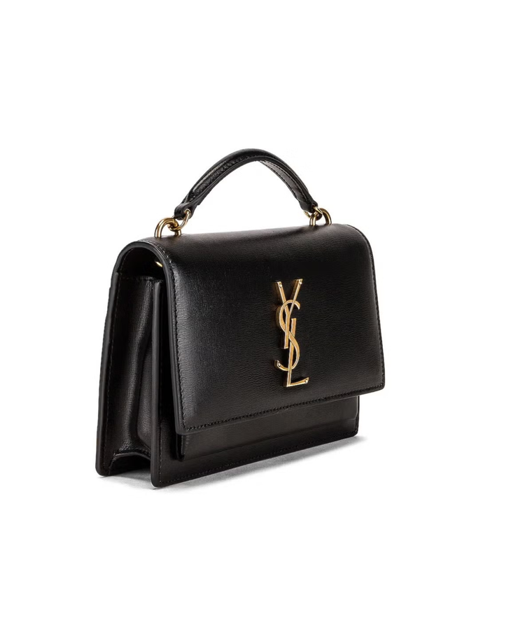 Black leather Cassandra cross body bag with gold YSL logo and top handle — Yves Saint Laurent | Endless UAE