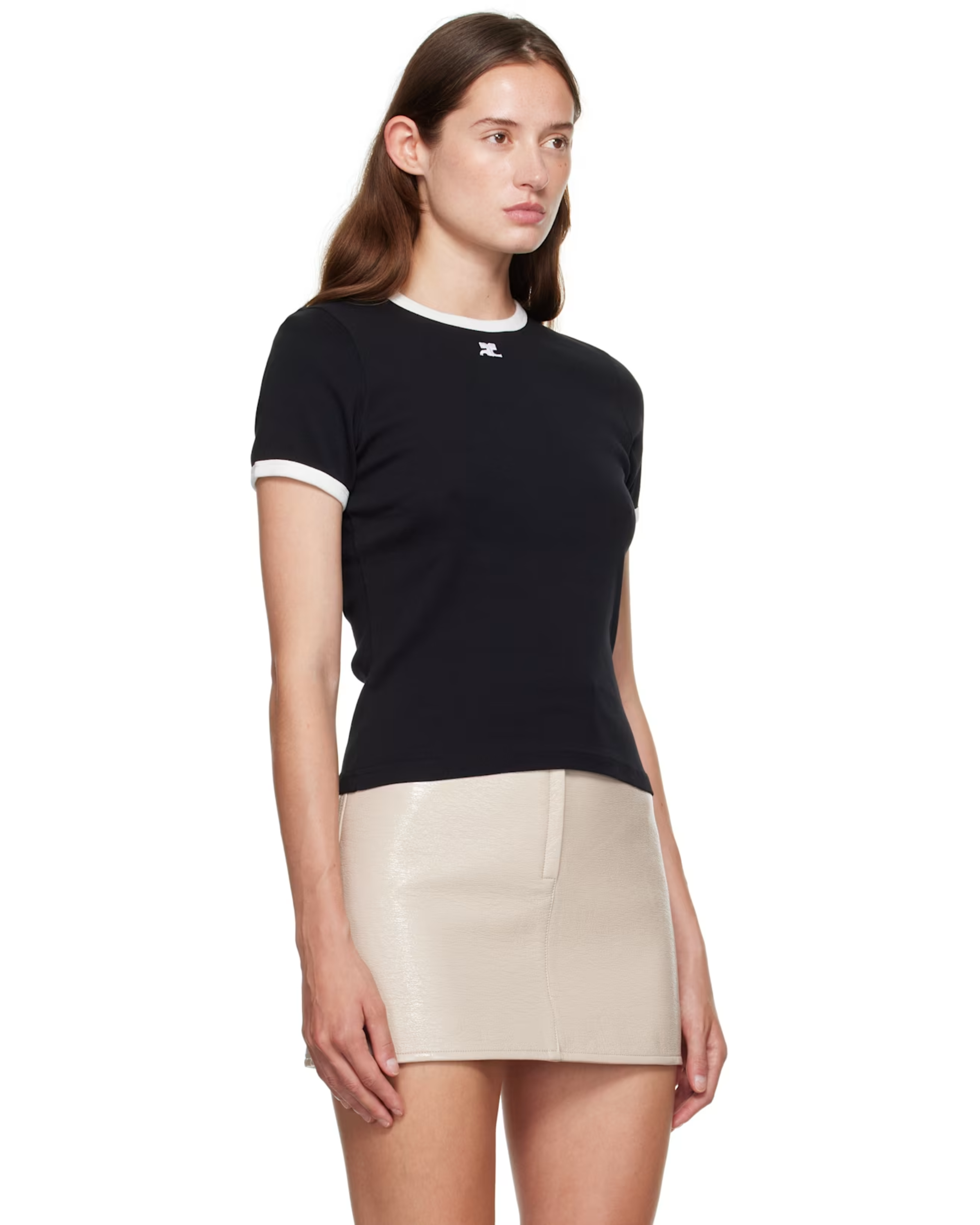 Woman wearing black and white contrast t-shirt with cream skirt — Courrèges | Endless UAE