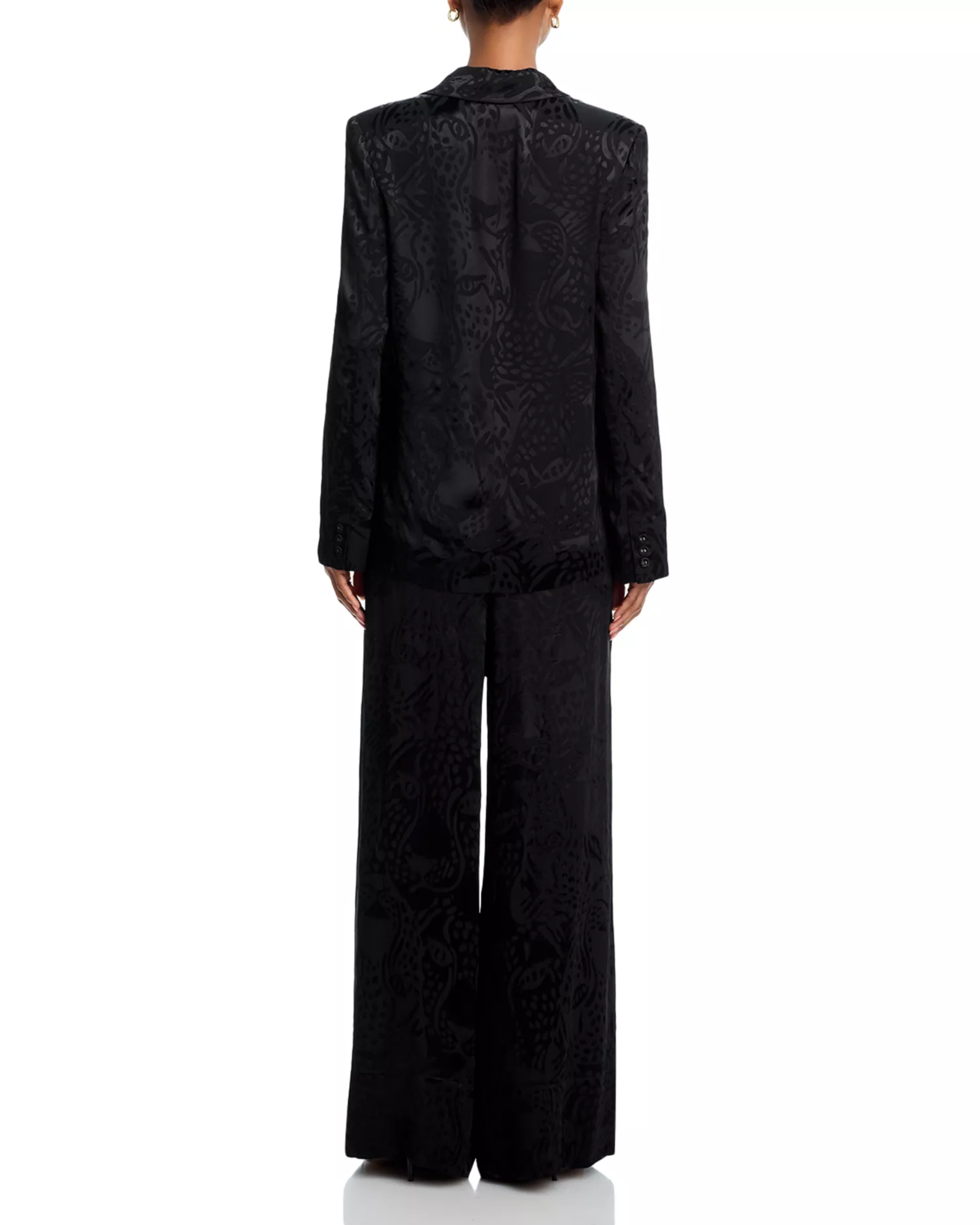 Woman wearing black leopard jacquard blazer and matching wide leg pants with accessories — Farm Rio | Endless UAE