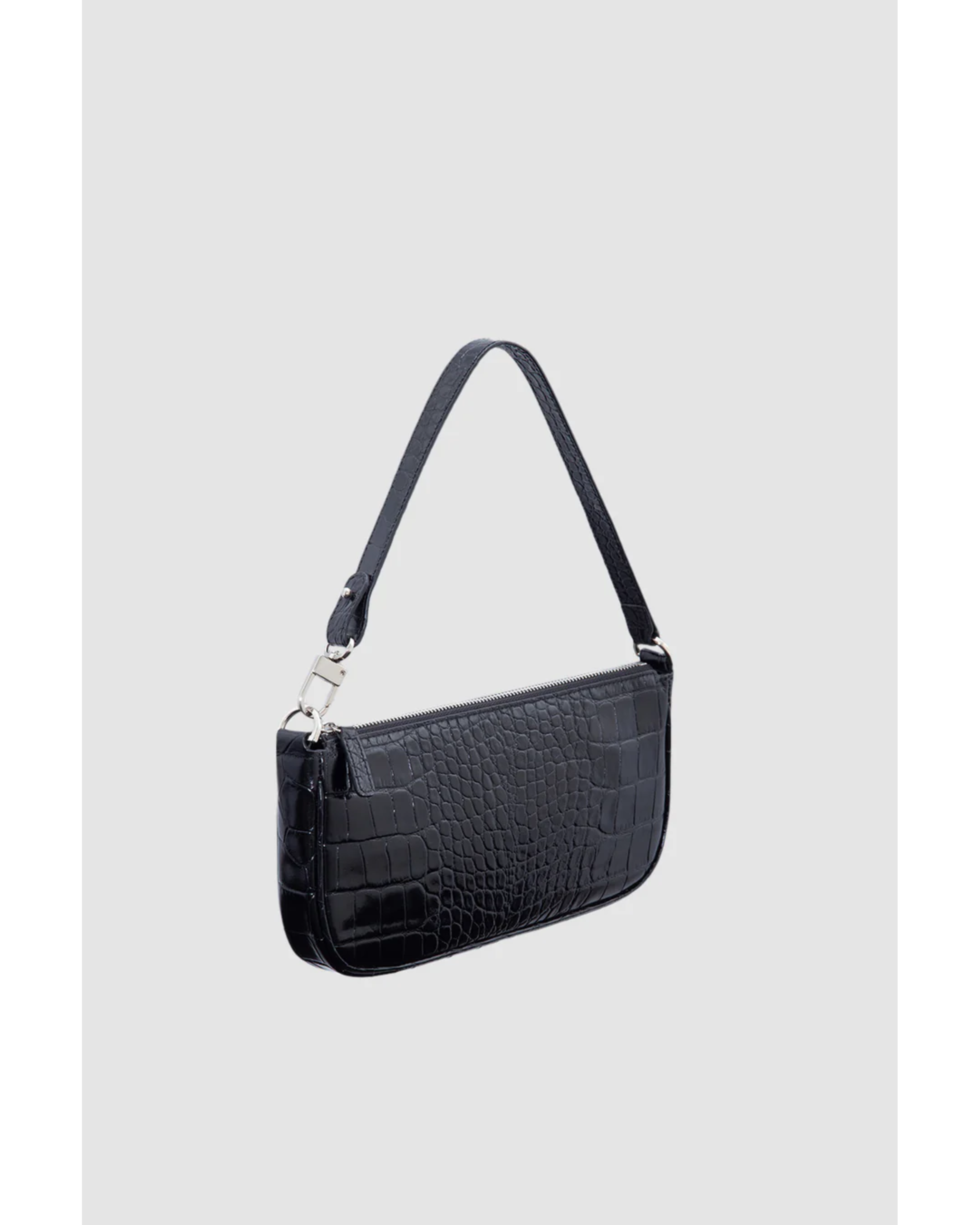 Black crocodile embossed leather shoulder bag held in hand against white background — By Far | Endless UAE
