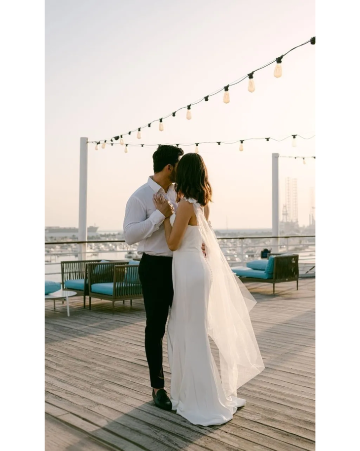 Bride in white convertible wedding dress with floral embellishments and flowing train — Dressarte Paris | Endless UAE
