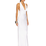 Woman wearing white halter drape bias gown with silver cuff bracelet — Norma Kamali | Endless UAE
