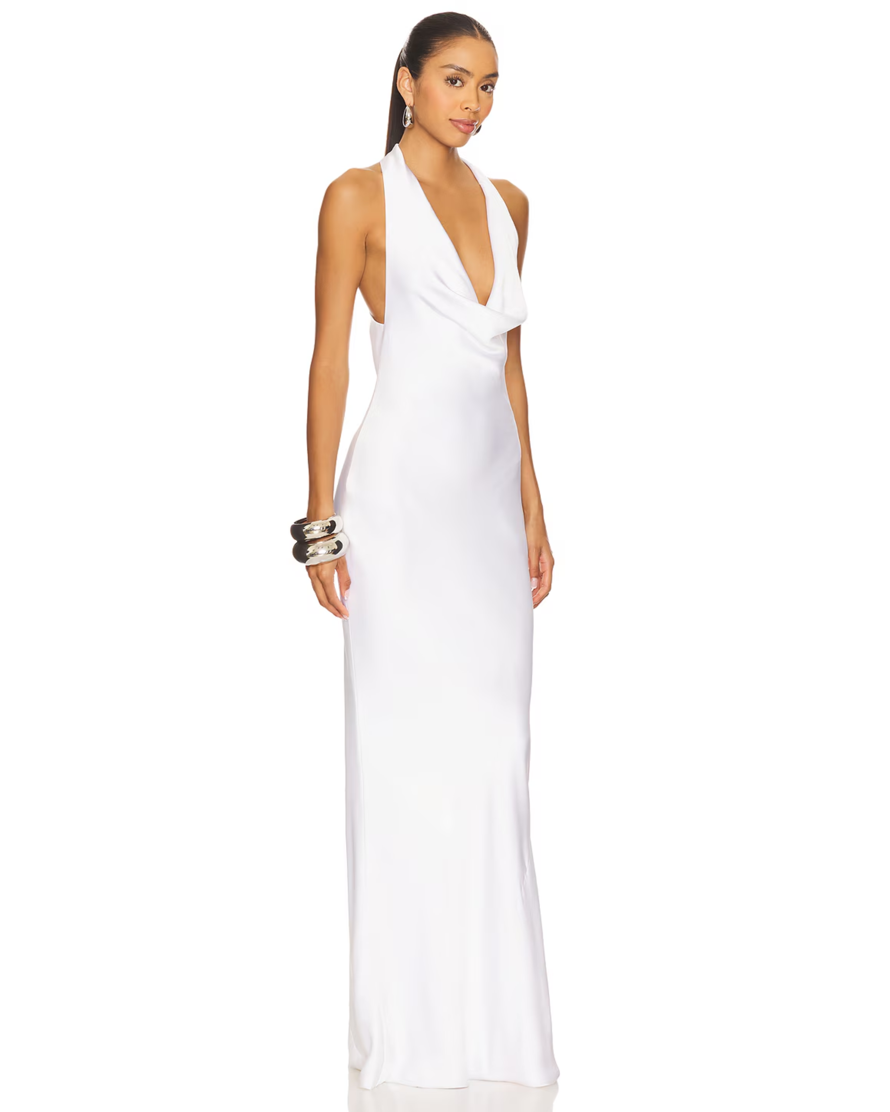 Woman wearing white halter drape bias gown with silver cuff bracelet — Norma Kamali | Endless UAE