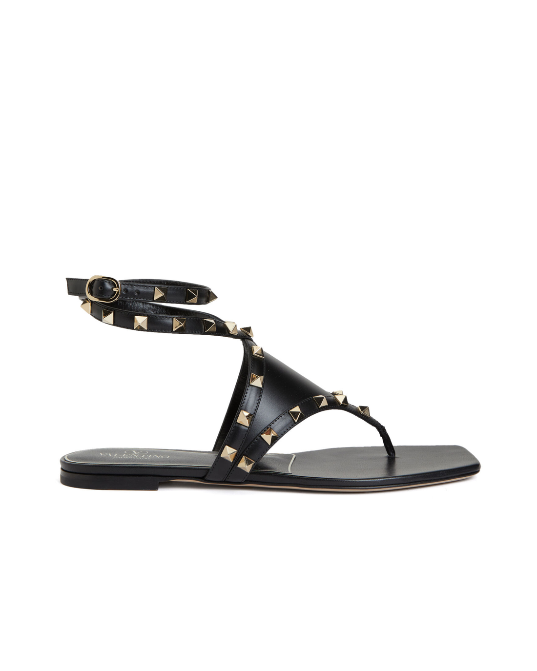Valentino Garavani Rockstud black leather thong sandals with gold pyramid studs and ankle wrap strap — Valentino Garavani | Endless UAE