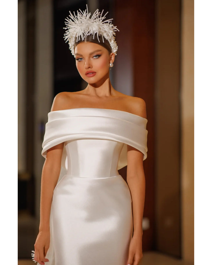 Elegant white off-shoulder satin dress with sculptural neckline and fitted silhouette — Mary Trufel Boutique | Endless UAE