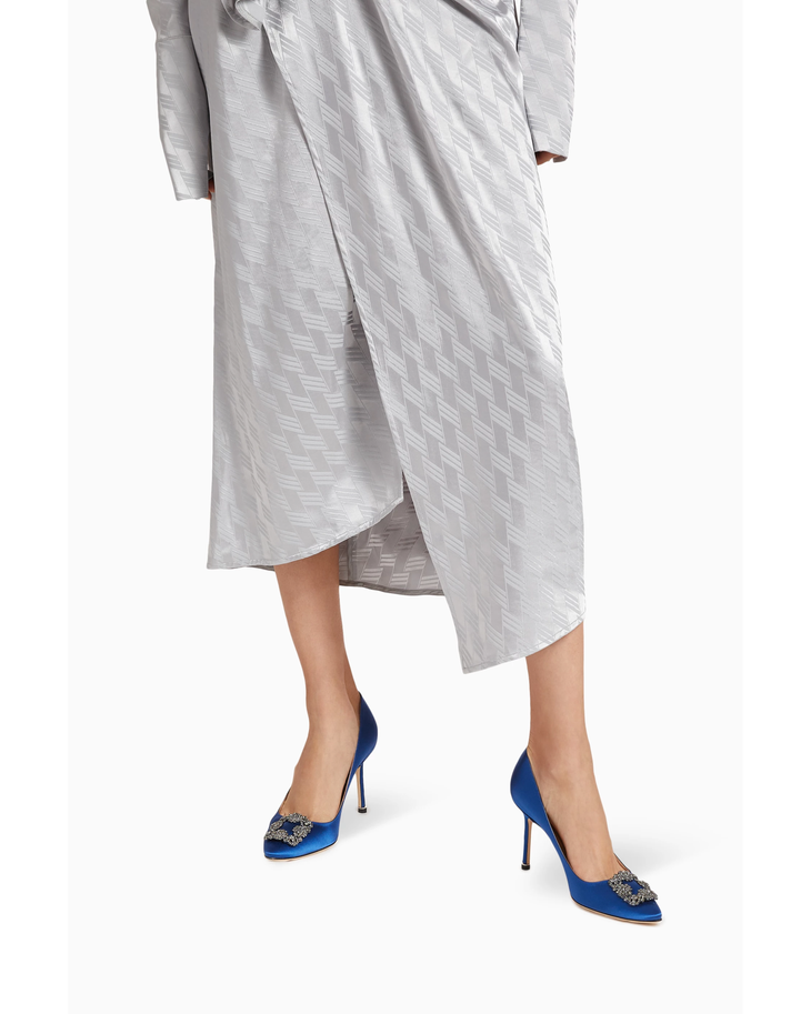 Blue satin pumps with crystal-embellished buckle and 90mm heel worn with silver midi skirt — Manolo Blahnik | Endless UAE