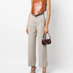 Dark brown croc-embossed mini shoulder bag with chain detail held in hand — By Far | Endless UAE