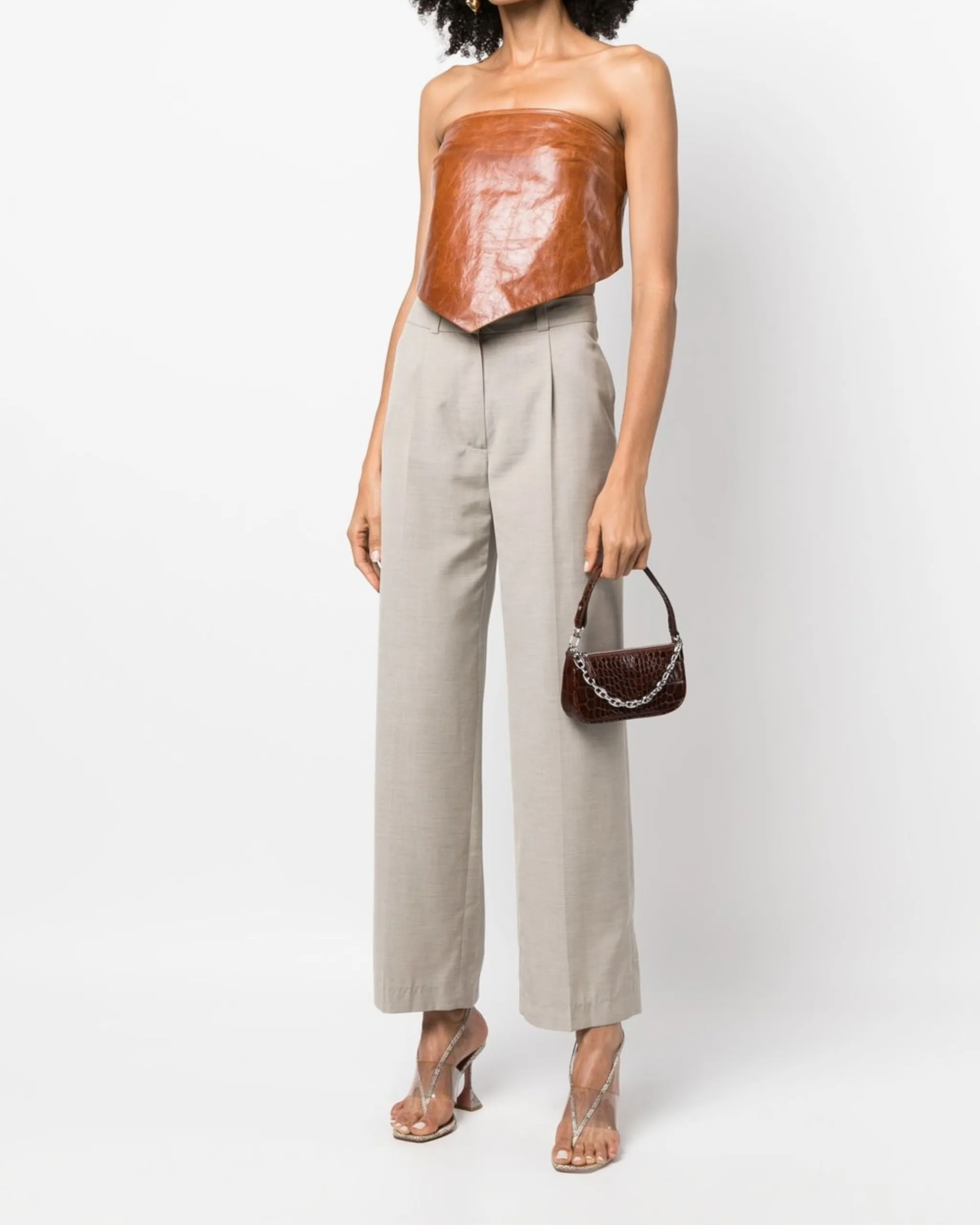 Dark brown croc-embossed mini shoulder bag with chain detail held in hand — By Far | Endless UAE