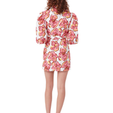 Woman wearing Explorer Mini Dress with pink floral print, puff sleeves, and gold belt — Torannce | Endless UAE