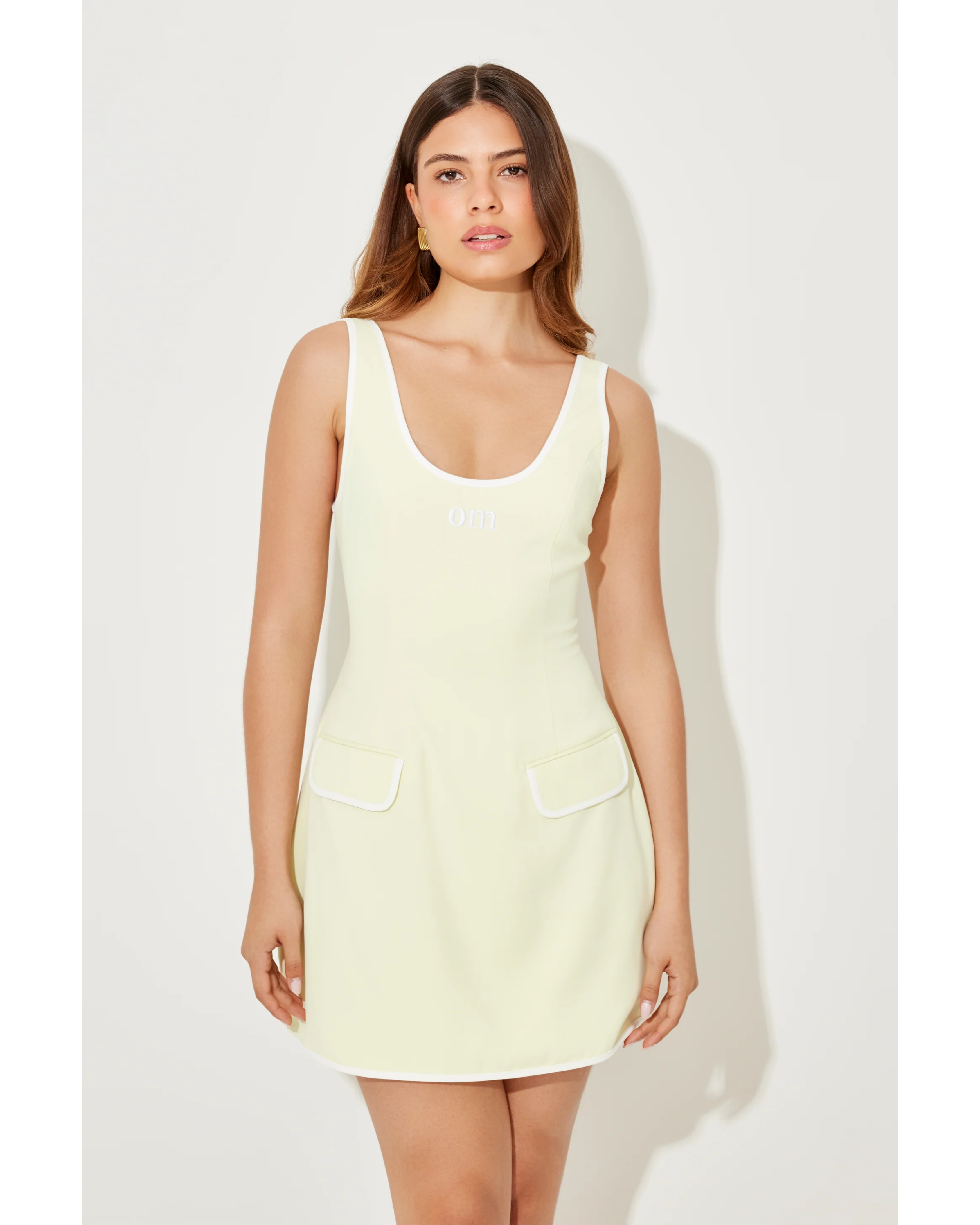 Cream sleeveless tennis dress with front pockets and scoop neckline — Odd Muse | Endless UAE