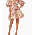 Woman wearing a cream linen mini dress with pink floral print, puff sleeves, and belted waist — ZIMMERMANN | Endless UAE