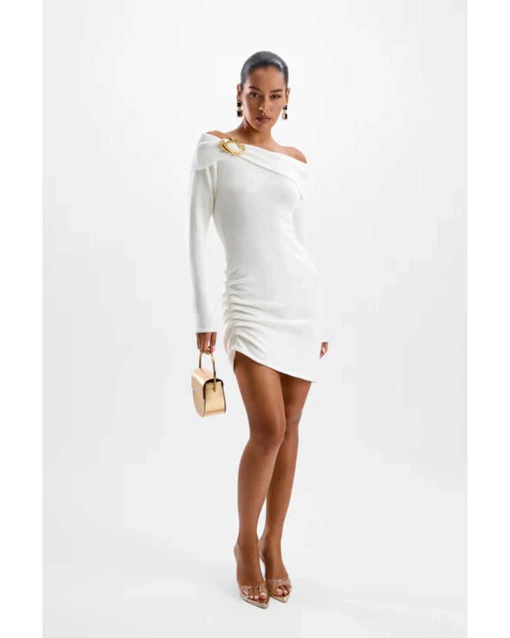 Woman in white off-shoulder long-sleeve knit dress with gold accents and matching accessories — Cin Cin | Endless UAE