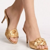 Gold twisted knot slide heels with thin stiletto heel — Giuseppe Zanotti | Endless UAE