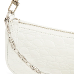 White quilted mini shoulder bag with silver hardware held up against neutral background — By Far | Endless UAE