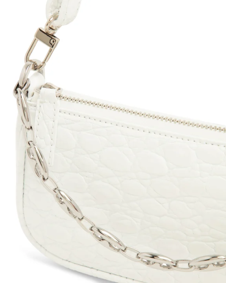 White quilted mini shoulder bag with silver hardware held up against neutral background — By Far | Endless UAE