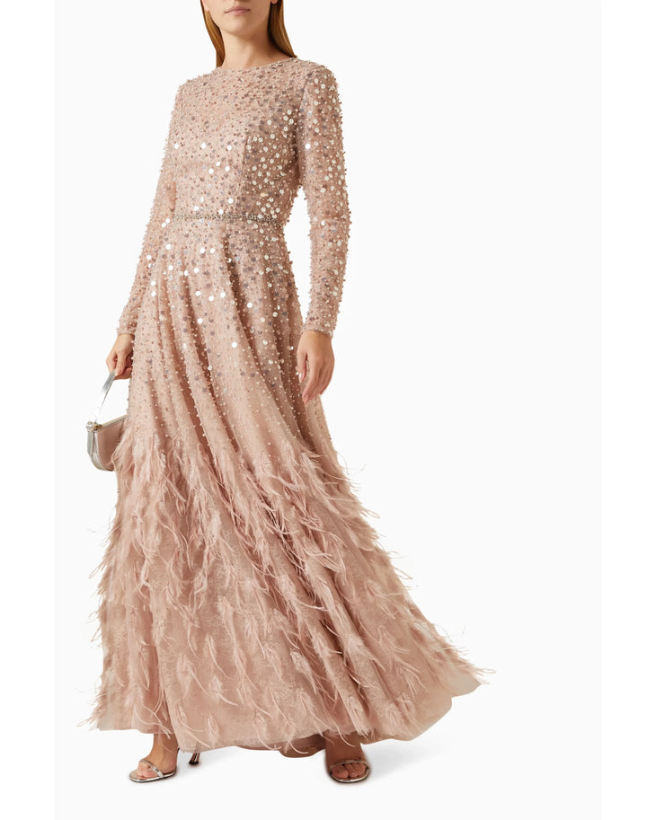 Blush pink sequin gown with feathered hem, long sleeves, and disc embellishments — Mac Duggal | Endless UAE